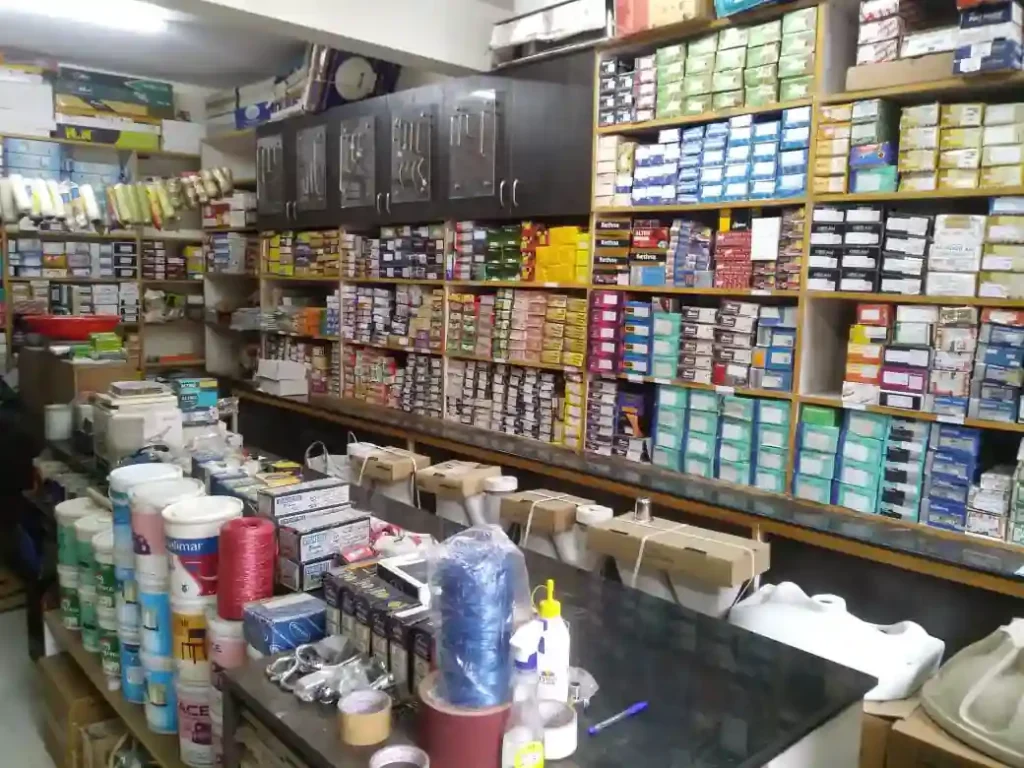 Real hardware shelves with dense boxed stock and counter inventory